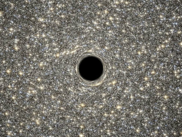 Сверхмассивная чёрная дыра, расположенная в центре компактной галактики (фото NASA, ESA, D. Coe, G. Bacon (STScI). 